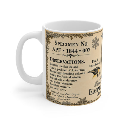 Vintage emperor penguin engraving with border flourishes and field notes on a white ceramic mug